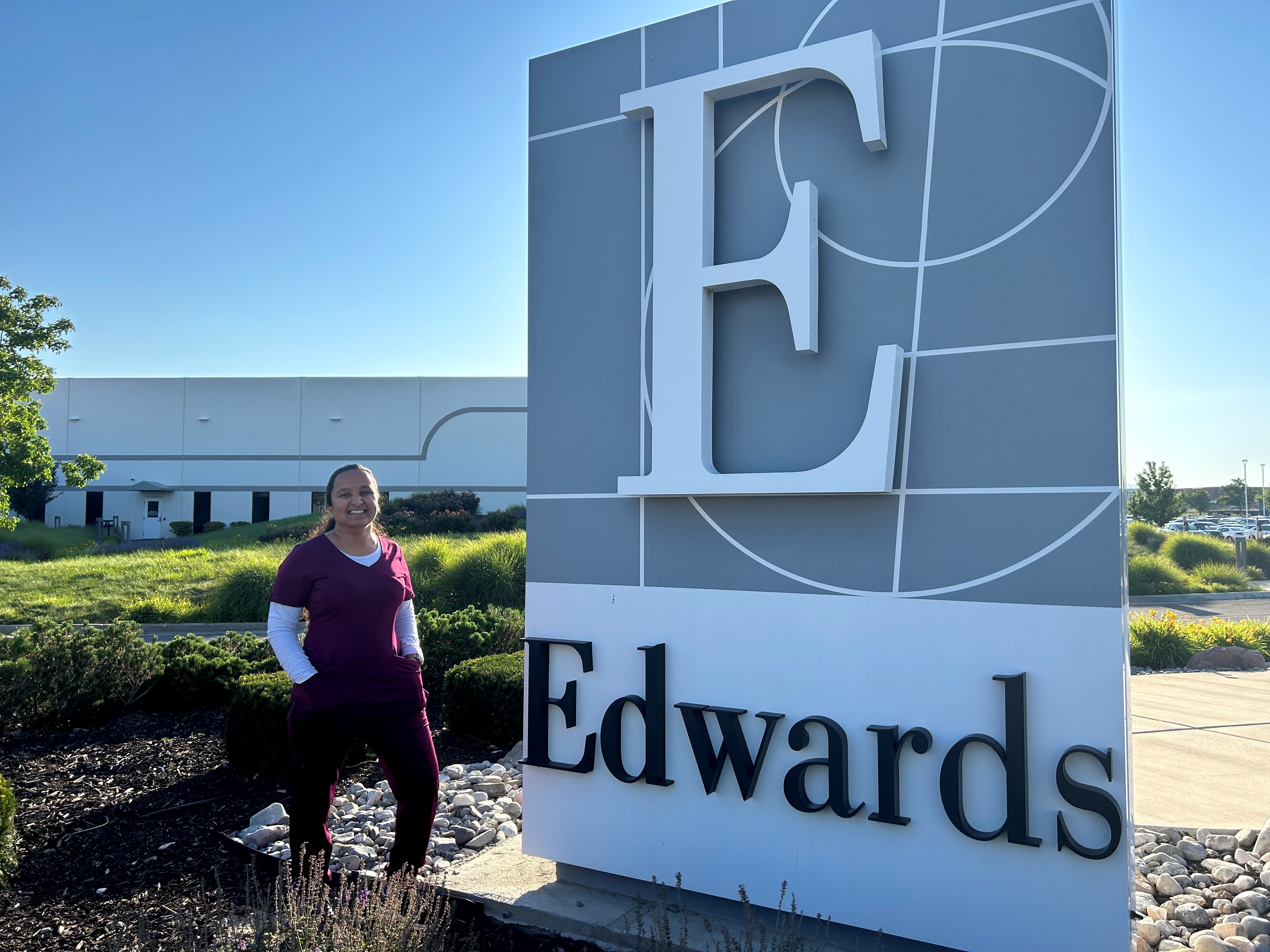 Shipra Rajput standing next to the Edwards sign