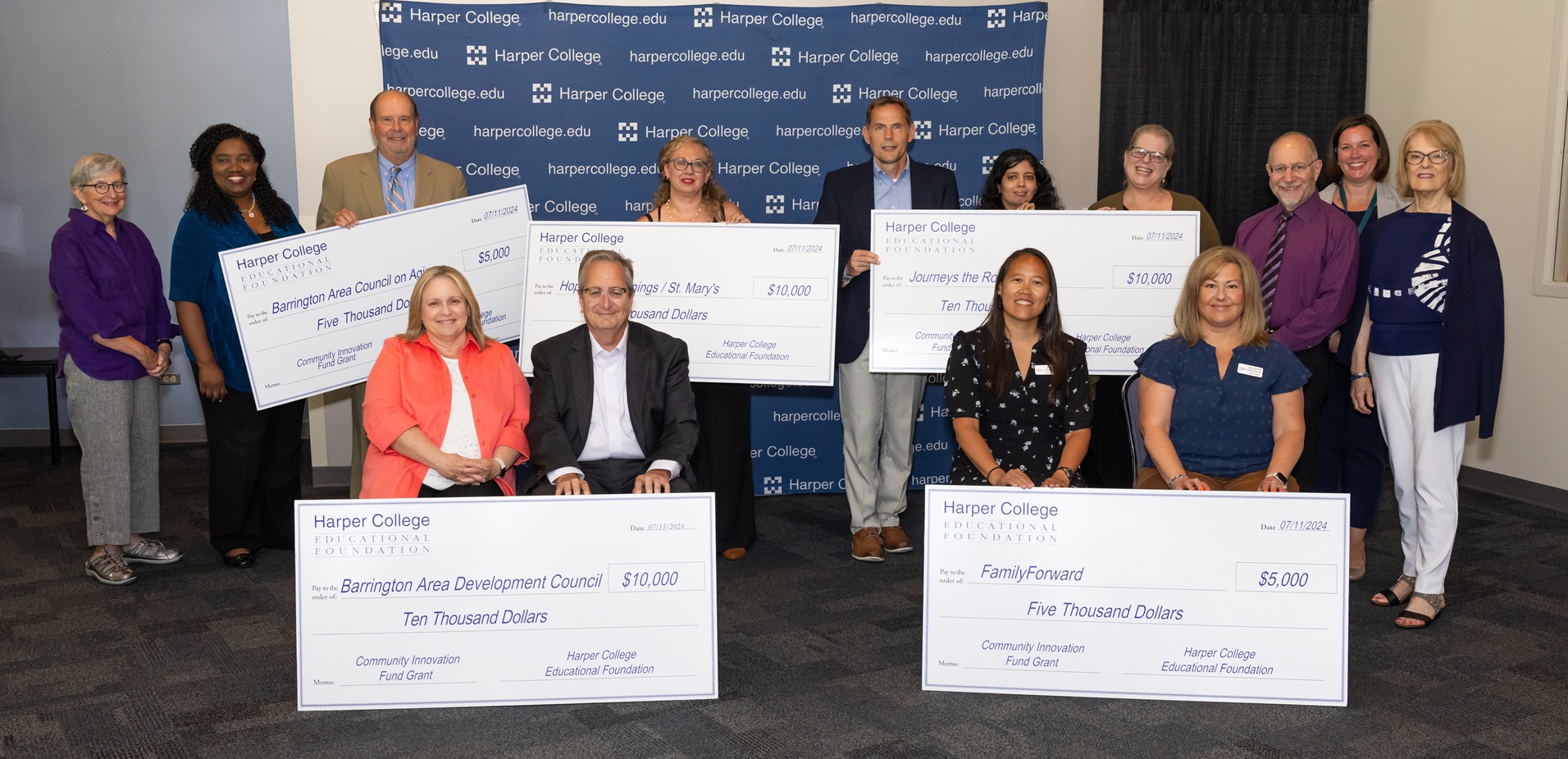 Community Innovation Fund Grant recipients pose with their commemorative checks from the Harper College Educational Foundation