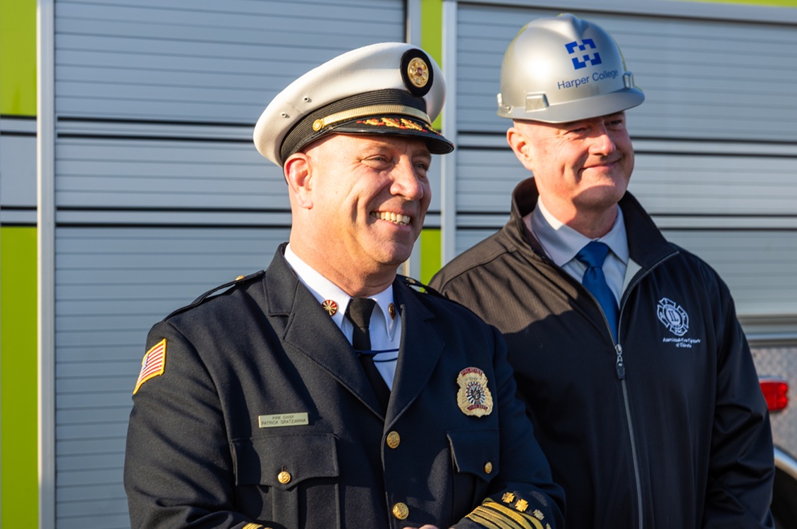 Palatine Fire Chief Patrick Gratzianna and Norm Bemis, coordinator of Harper's Fire Science Technology & Emergency and Disaster Management Program, celebrate the groundbreaking of Harper's new Emergency Services Training Center.