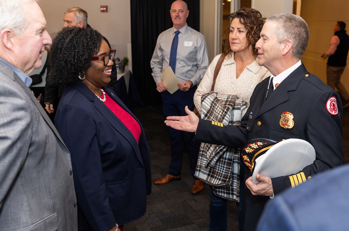 Dr. Avis Proctor interacts with Palatine Deputy Fire Chief Scott Mackeben during the groundbreaking celebration for Harper's new Emergency Services Training Center.