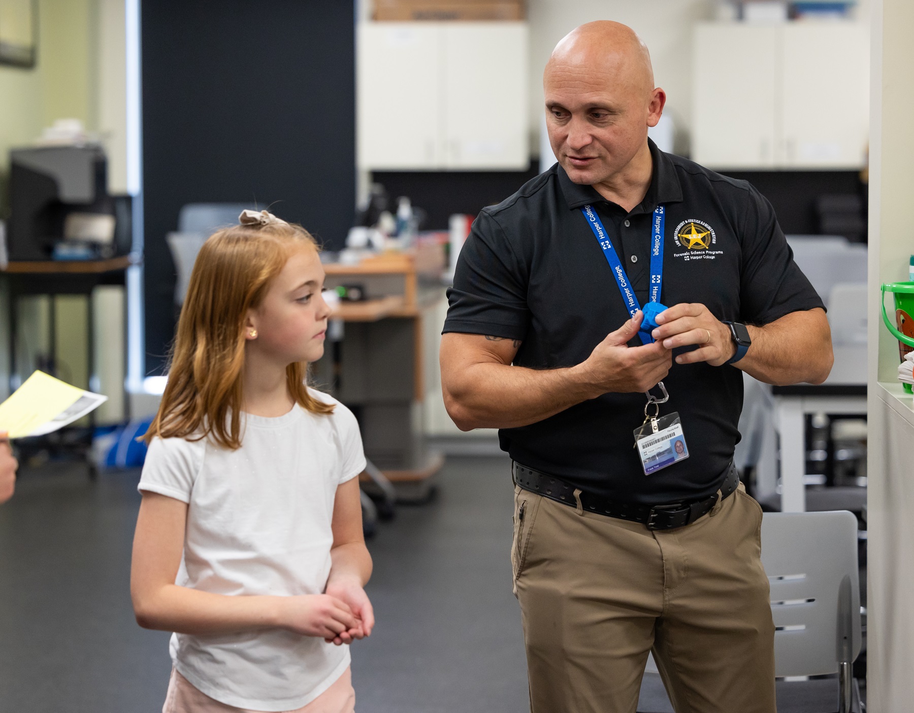 A student interacts with Frank Trost at Experience Day