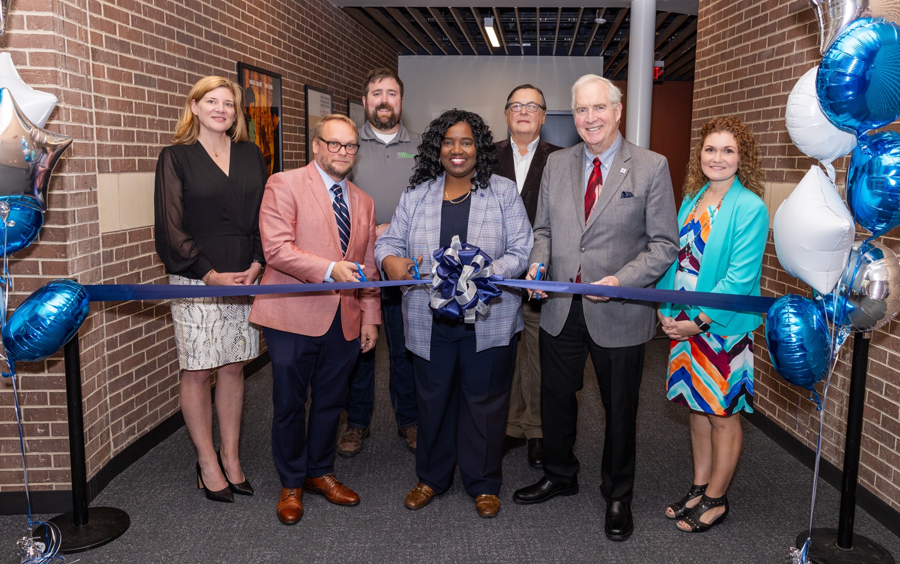 Dr. Avis Proctor, Associate Professor Brian Shelton and others cut the ribbon on the new Film Lab