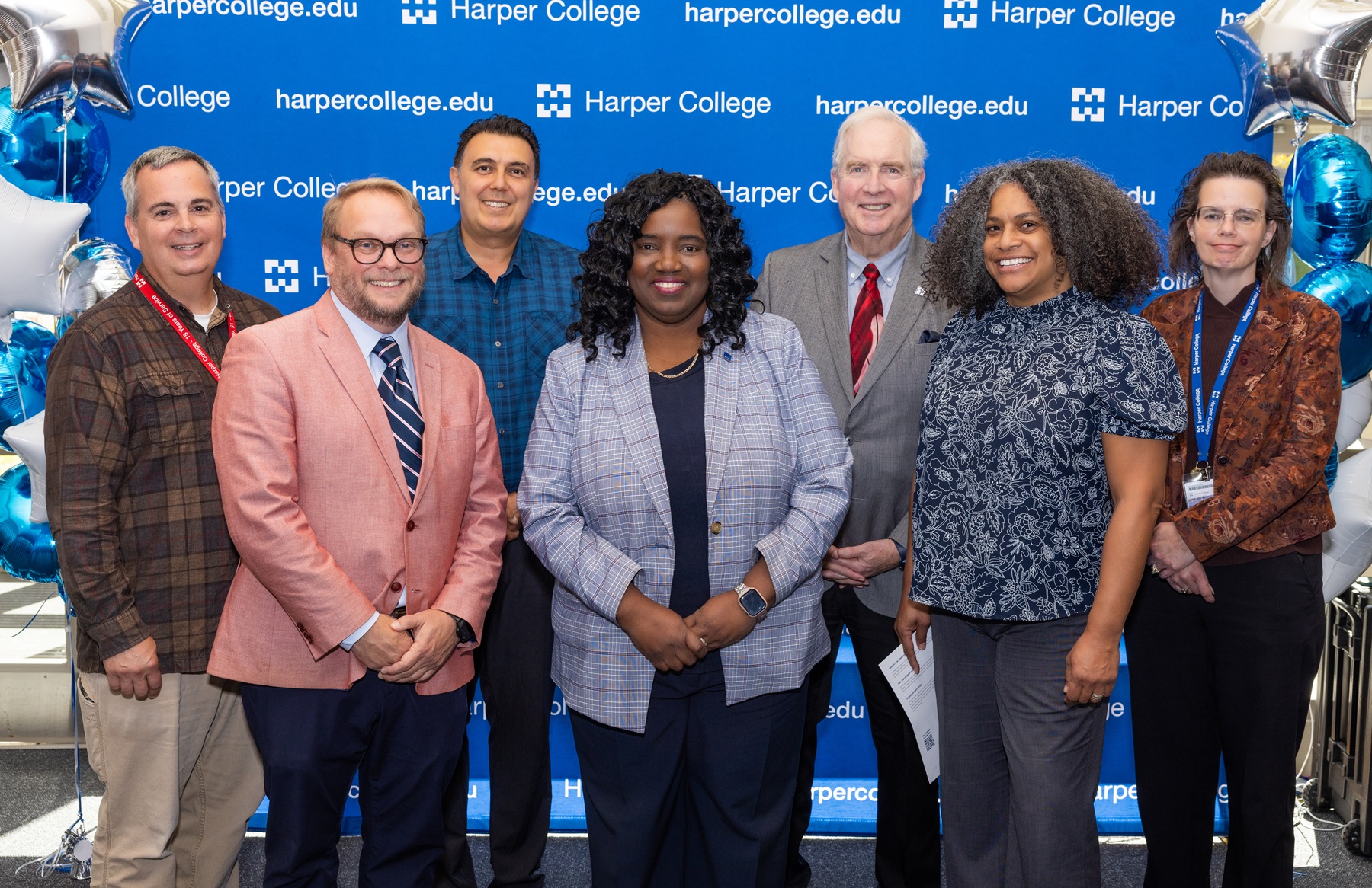 President Avis Proctor, Associate Professor Brian Shelton and Harper leaders celebrate the opening of the Film Lab.