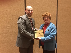 Dean Rebecca Lake receives the award from ICCCA President-elect Michael Boyd