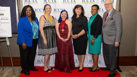 Three Harper College employees honored by the ICCTA pose with Harper's president, a dean and board chair