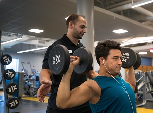 Harper College personal trainer Joe Mago works with a client