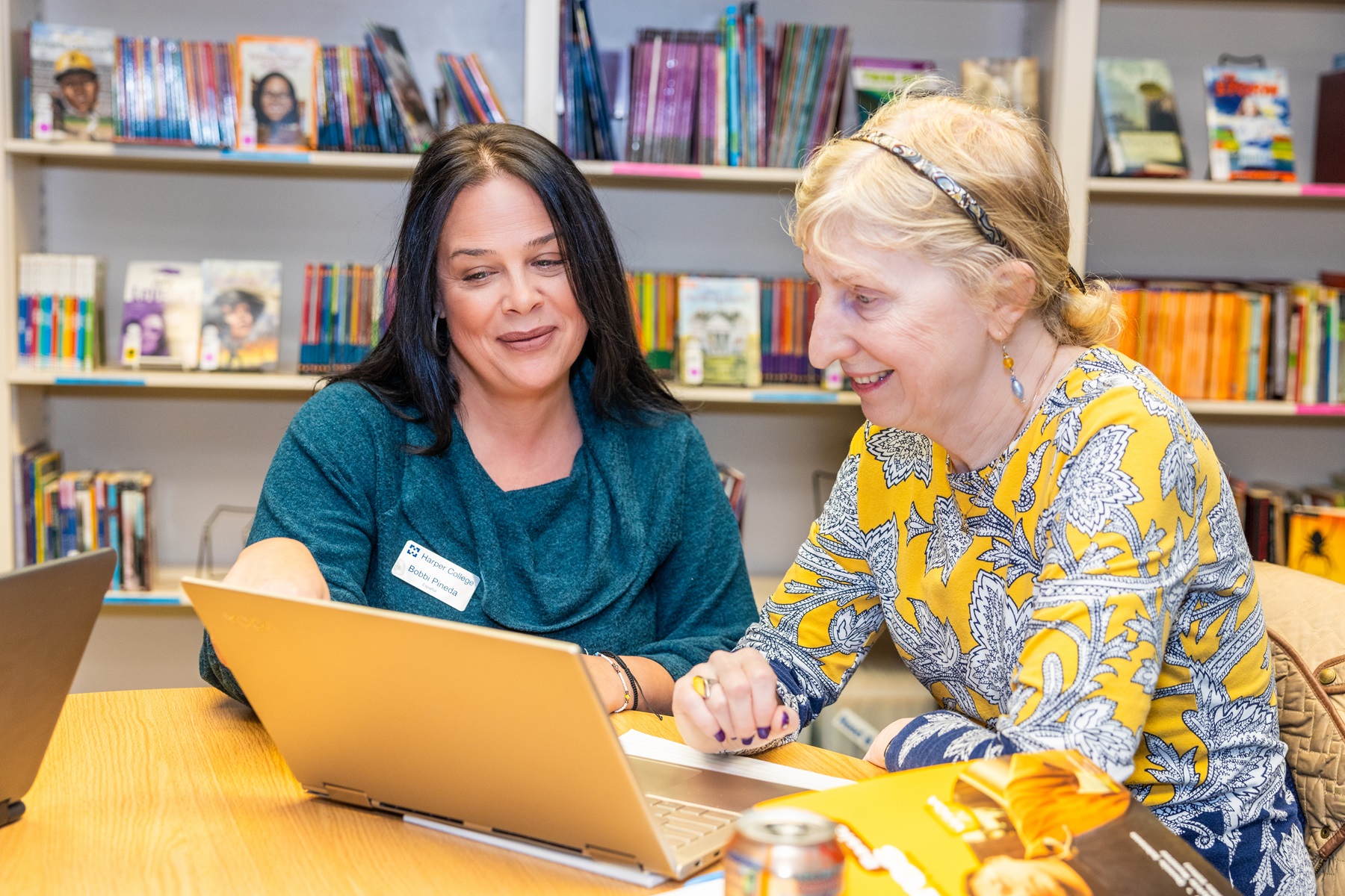 Bobbi Pineda helps a student at Harper College's Learning and Career Center.