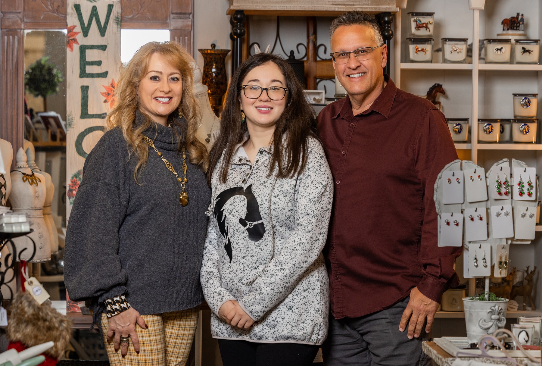 Ester, Sarah and Leon Lima stand in one of the locations of Téia Candle Co.