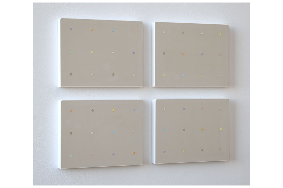 abstract painting consisting of four wood panels with rows of different colored dots