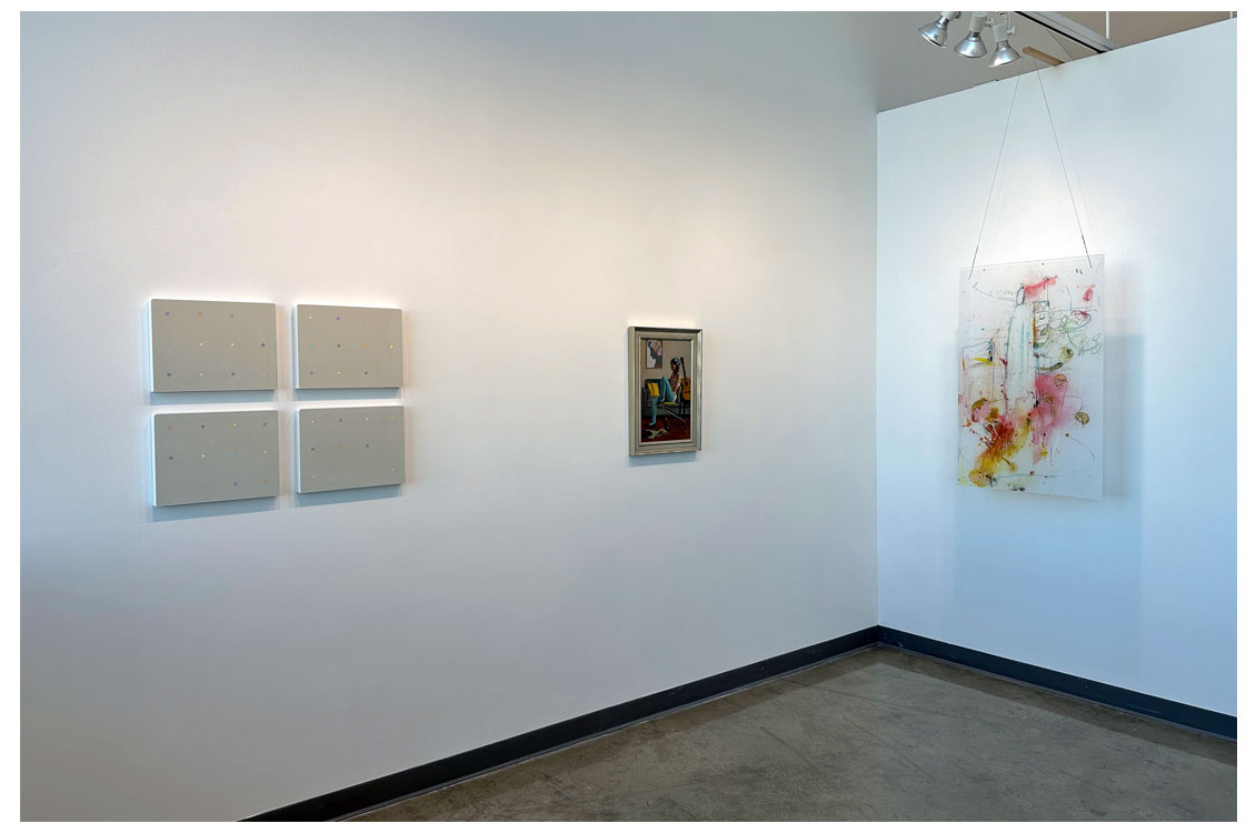 interior corner gallery view with abstract works on wall