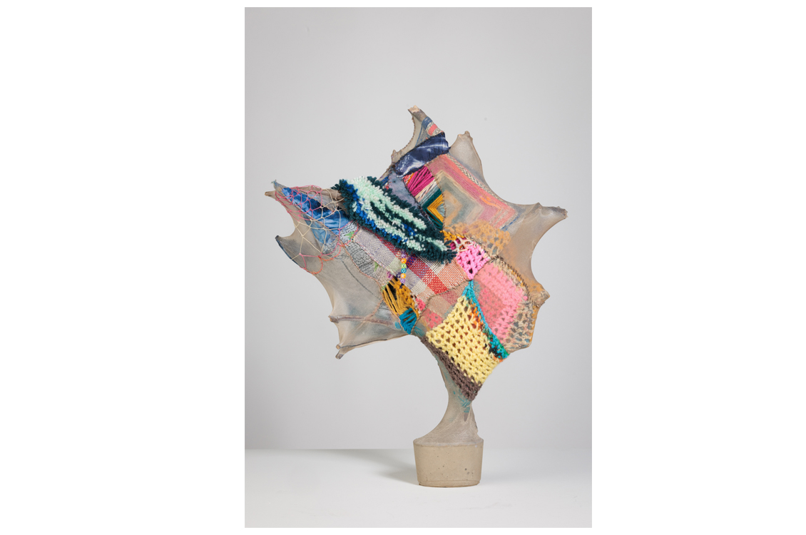 abstract sculpture with floral motifs and pastel colors