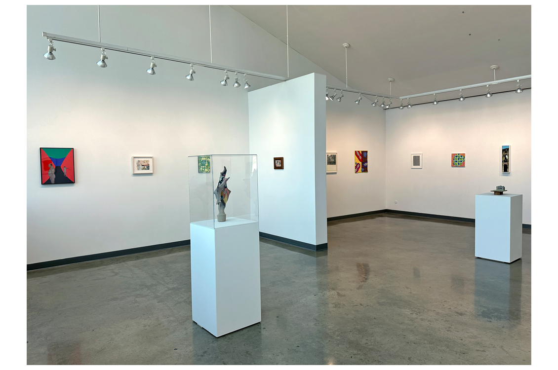 interior gallery view with sculpture in foreground