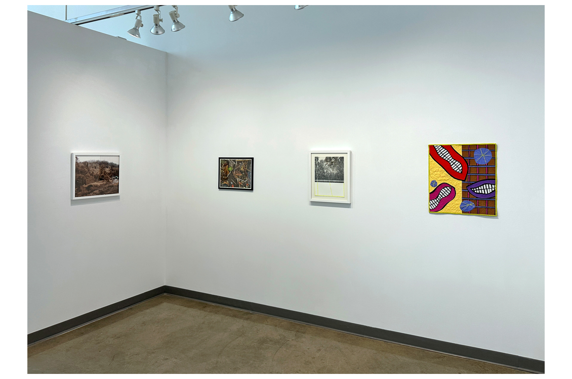 corner of gallery with paintings on wall