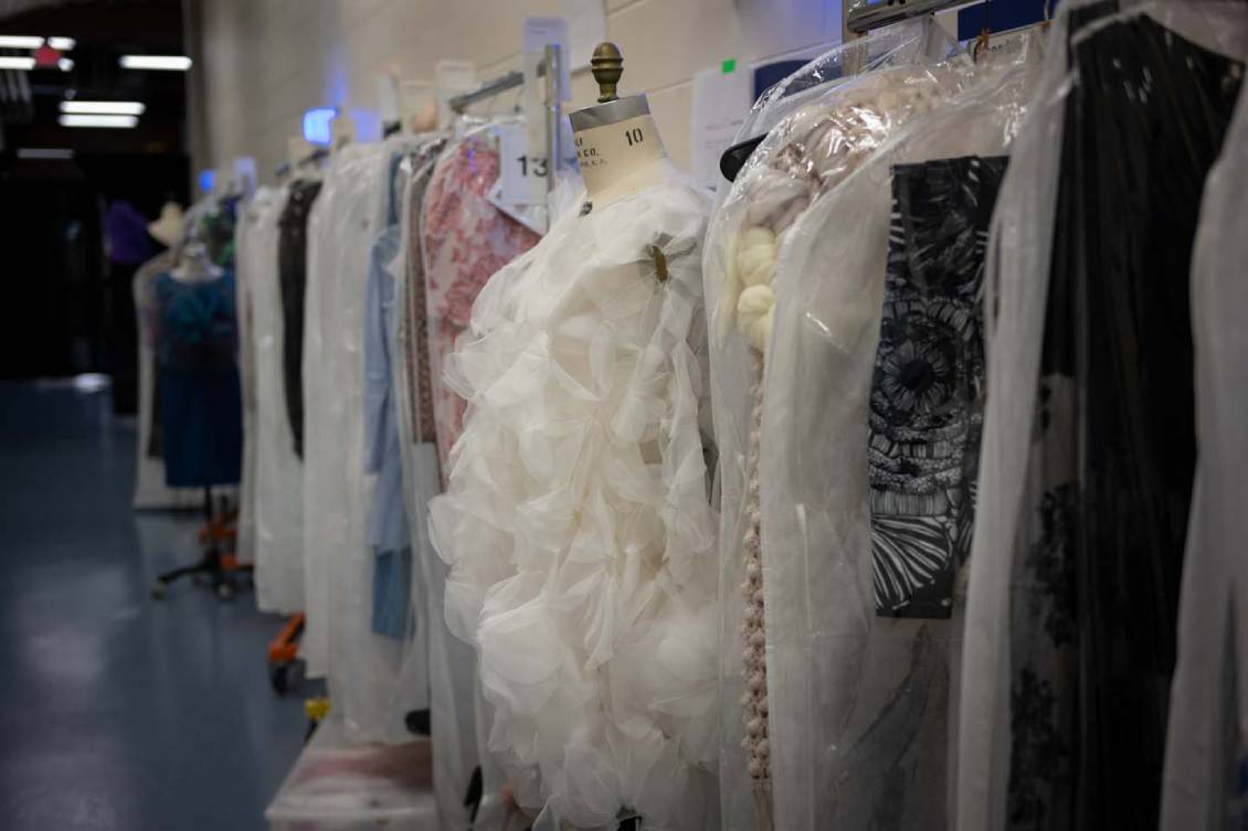 Clothing hanging on a rack before the show.