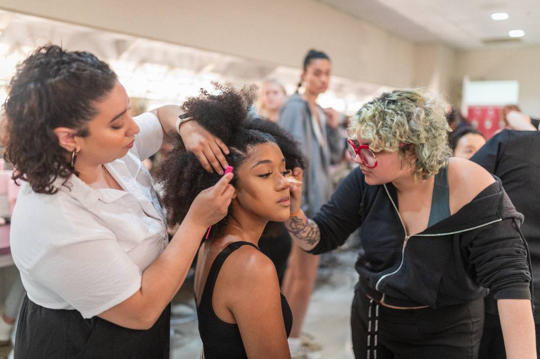 Model getting hair and makeup done