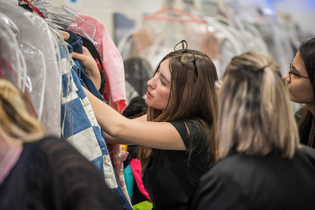 Fashion students looking at clothes