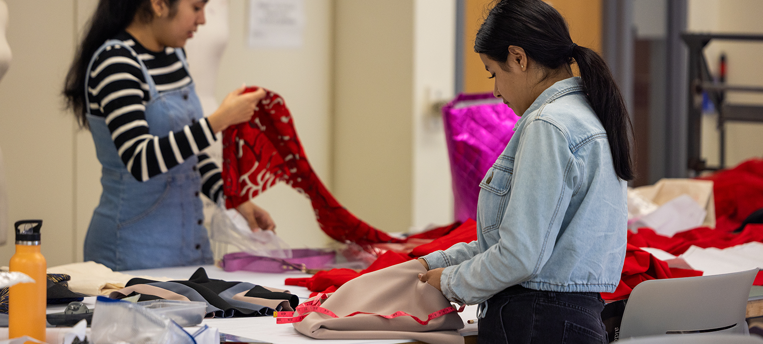 Students working with fabric in fashion lab