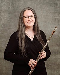 photo of Leah Stevens holding a flute