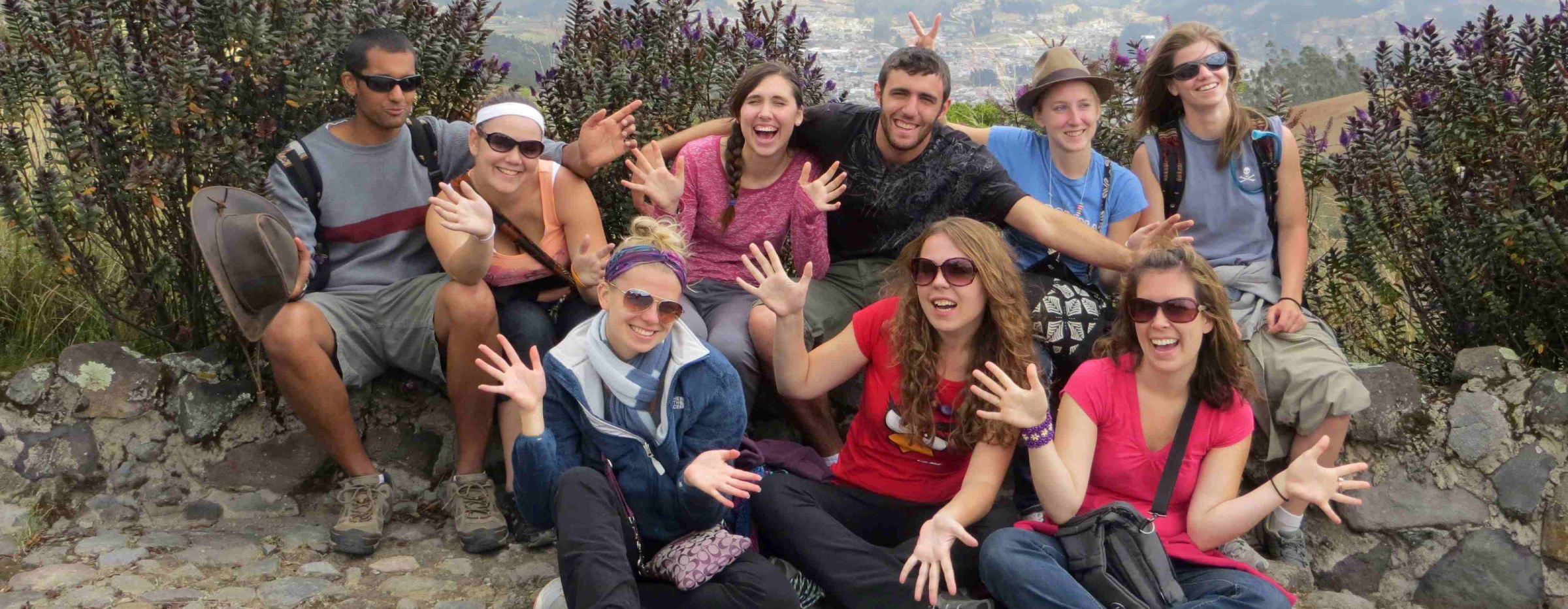 students smiling for a group photo outdoors in Ecuador