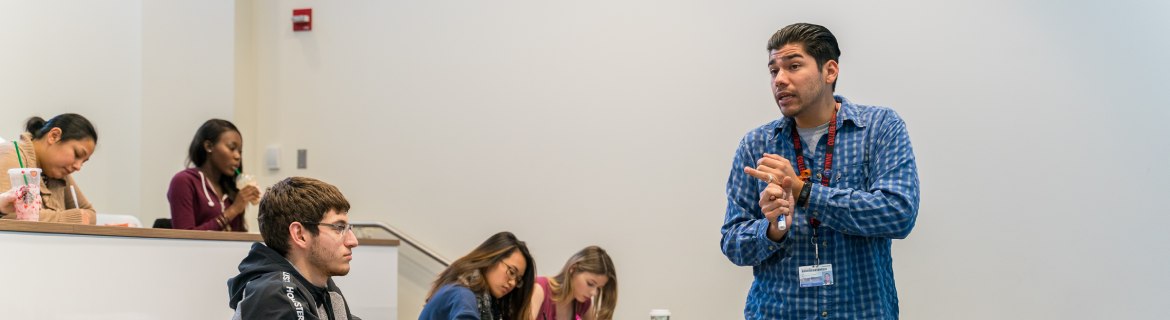 ESL Endorsement students chatting in a lecture hall.