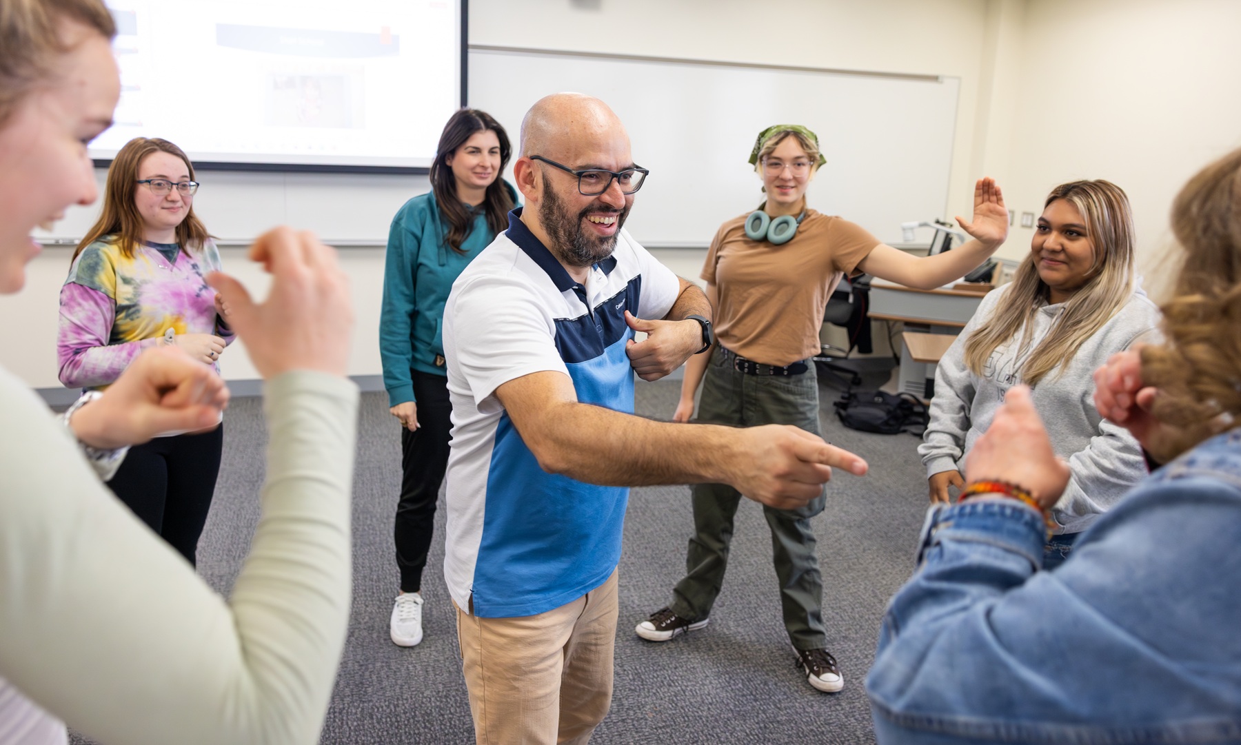 Sign Language ASL instructor leading a sign language course for beginners.