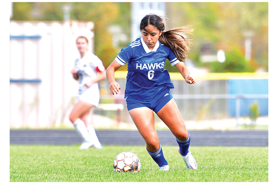 student playing soccer