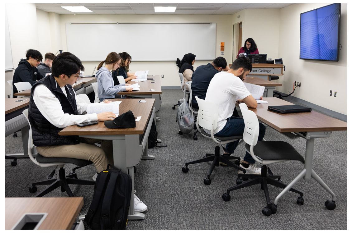 students in a classroom taking notes