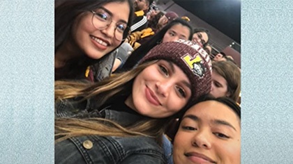 Arianna Mormino with friends at a Loyola basketball game