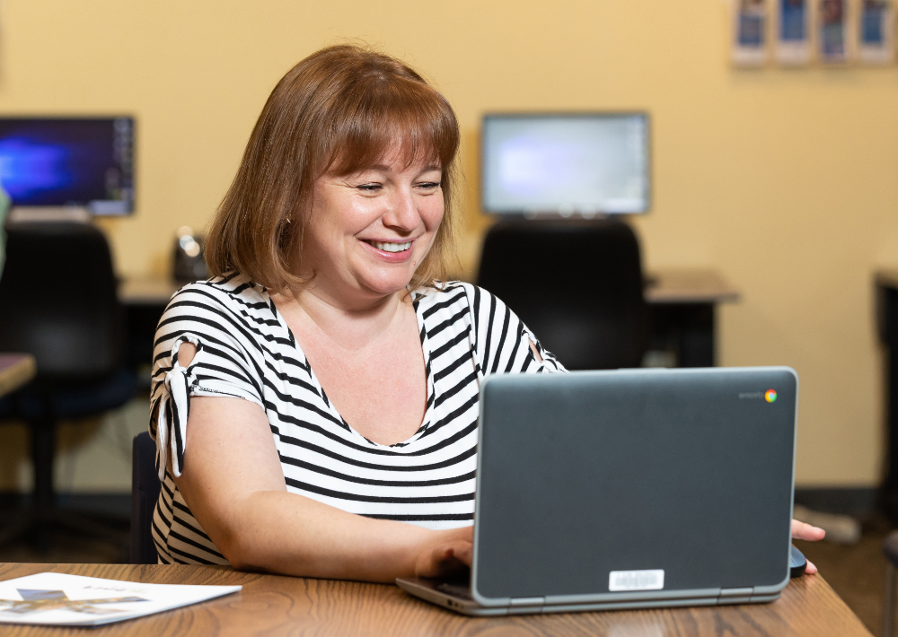Harper College Technology Loan Program Student in an AED program uses a laptop borrowed from the Harper College library in Palatine, Illinois.