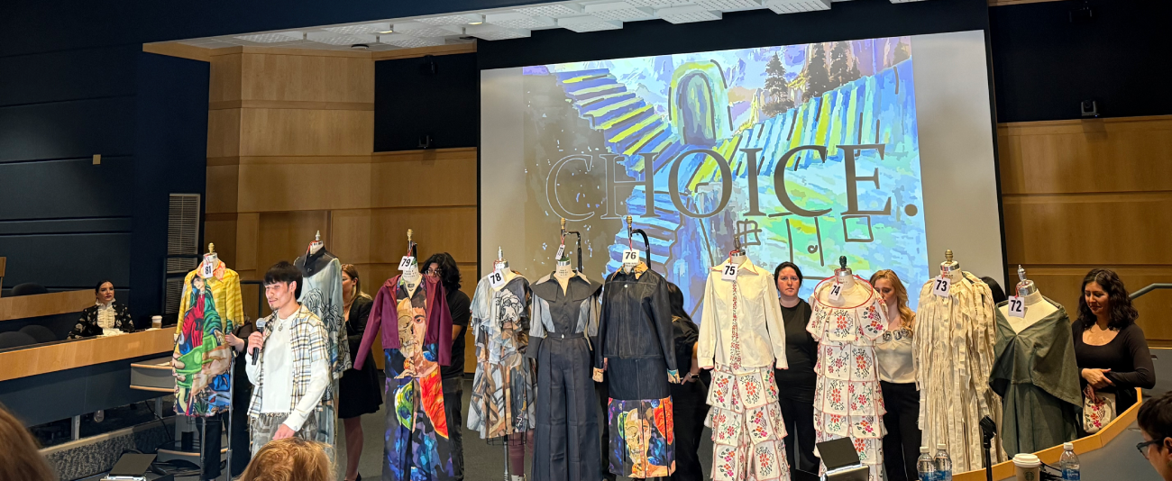 Student-designed garments on display during a fashion show presentation.