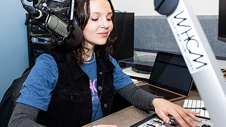 student in radio booth