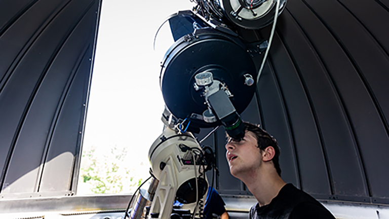 student at telescope